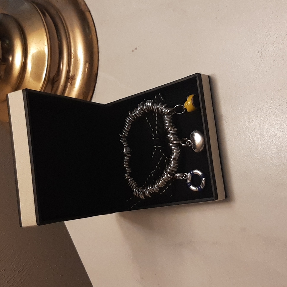 Links of London silver charm bracelet with three charms